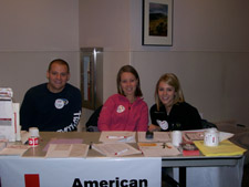 students at American Red Cross table at an event